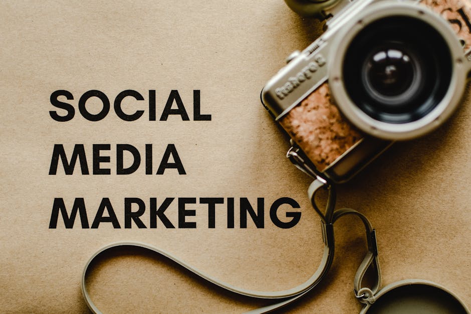 A vintage camera on brown paper with 'SOCIAL MEDIA MARKETING' text, perfect for marketing visuals